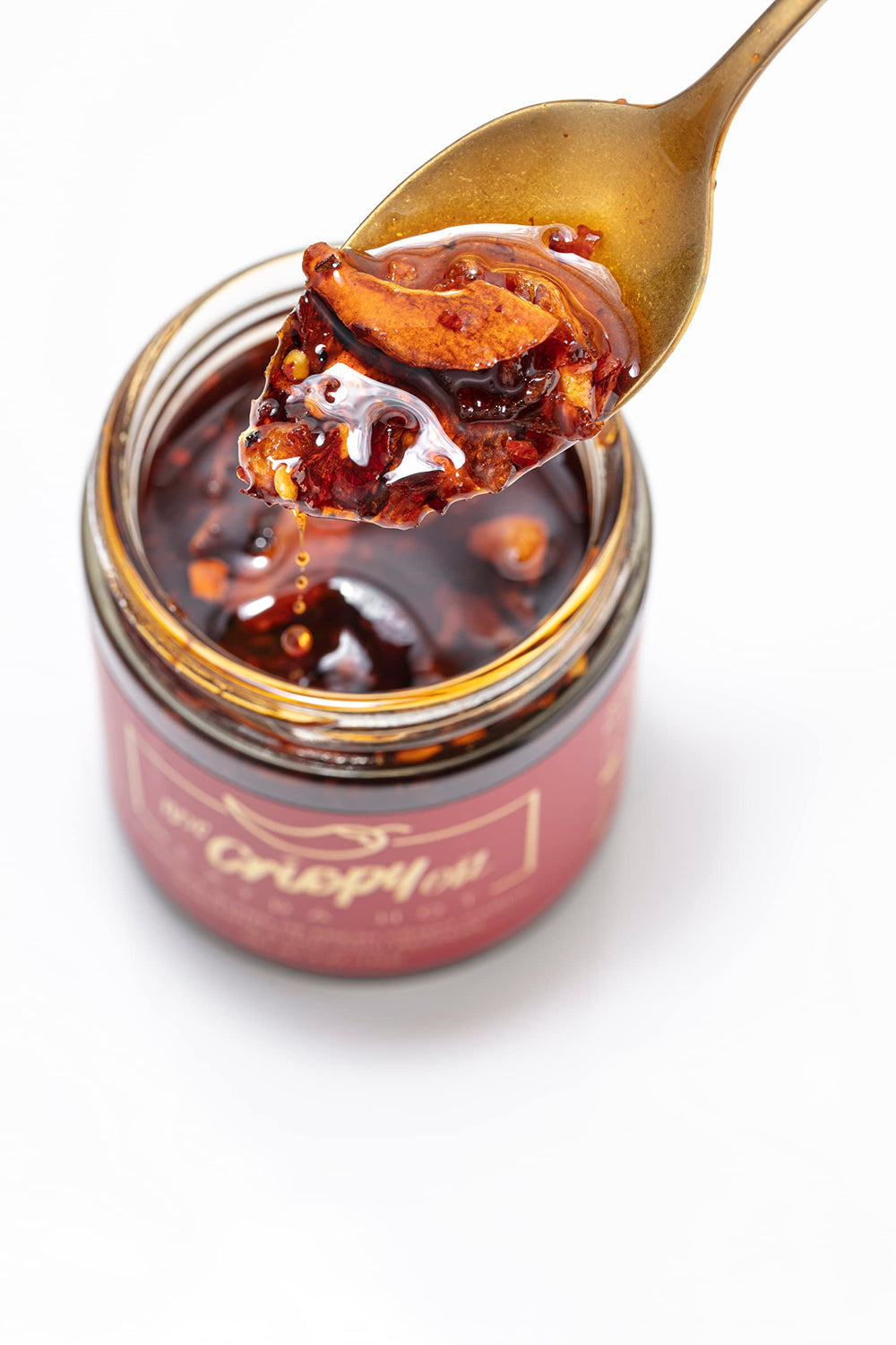 Hot Crispy Oil jar label detail highlighting small-batch, all-natural ingredients