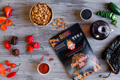 Hot Monkey Nuts on a charcuterie board adding spicy crunch and party appeal