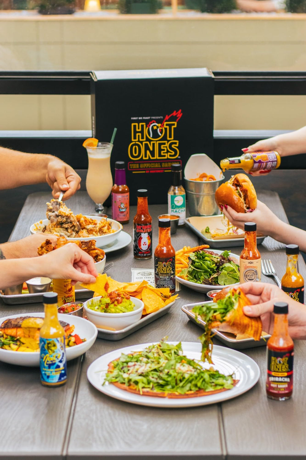 HOT ONES paired with wings showing how sauces elevate shared snacks