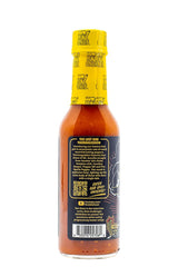 HOT ONES Thermageddon bottle next to spoon for scale and serving suggestion