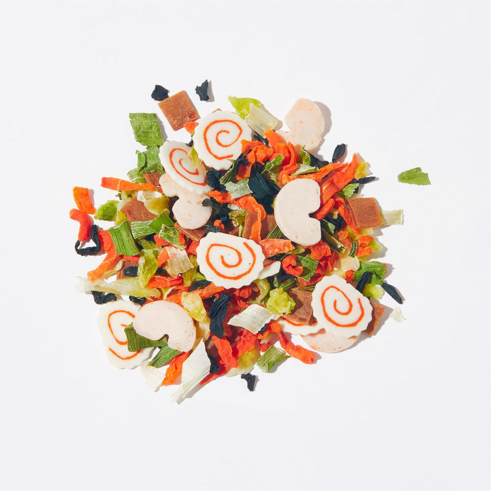 HOXY narutomaki slices detail, colorful garnish that improves presentation