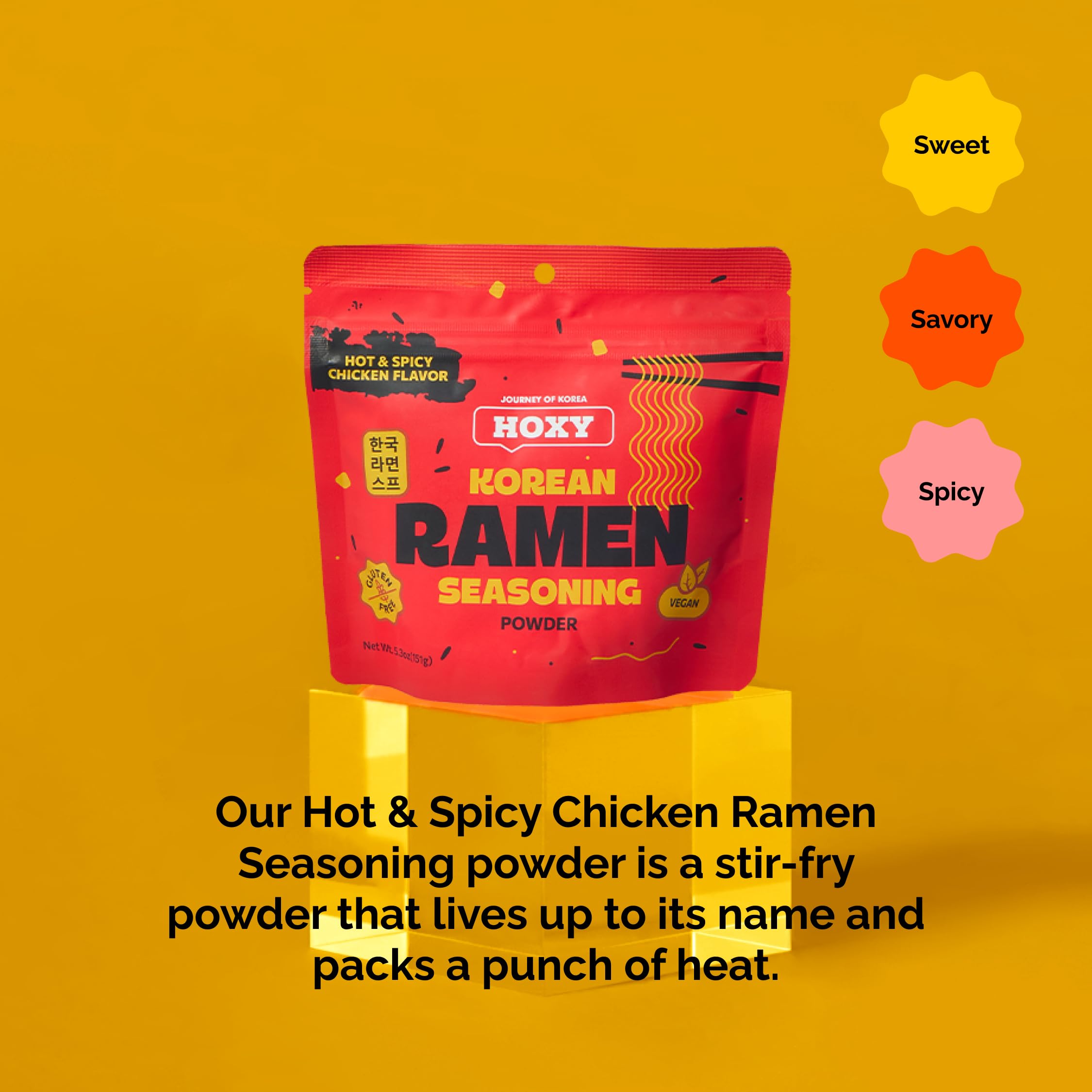 HOXY seasoning mixed into saucy noodles showing bold color and flavorful coating