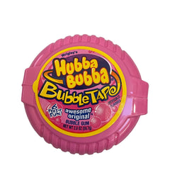Hand holding Hubba Bubba tape demonstrating quick dispense and on-the-go use