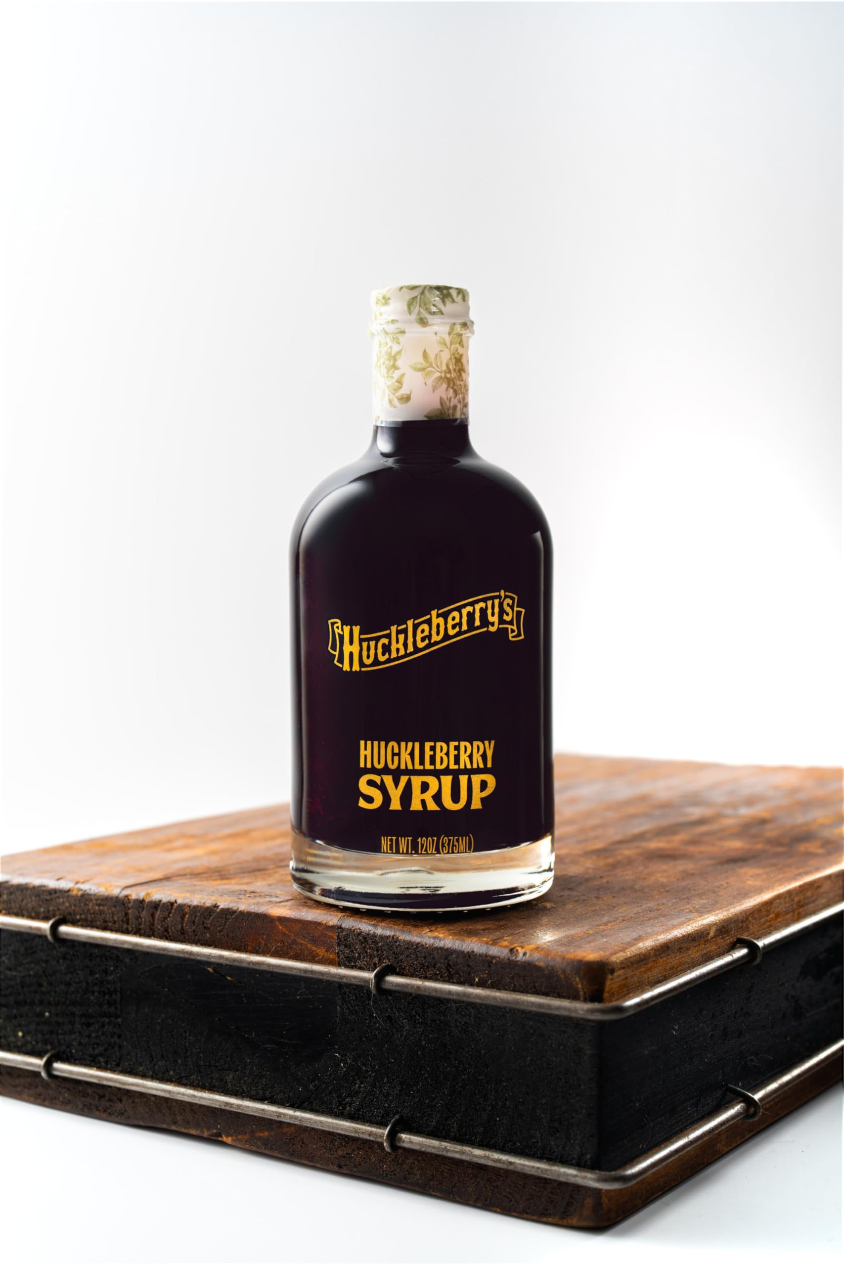 HUCKLEBERRY'S BREAKFAST · LUNCH bottle on breakfast table adding gourmet touch