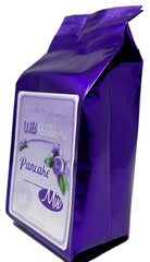 Huckleberry Haven pancake stack with huckleberry flavor visible and fluffy texture
