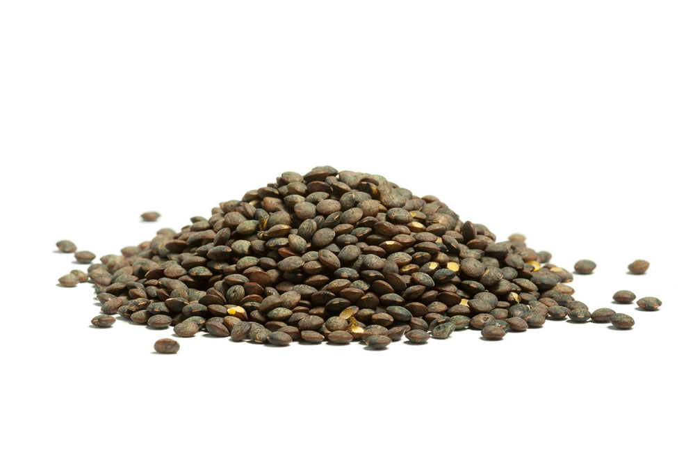 Hunza Natural Foods measuring cup with dry lentils showing portion control