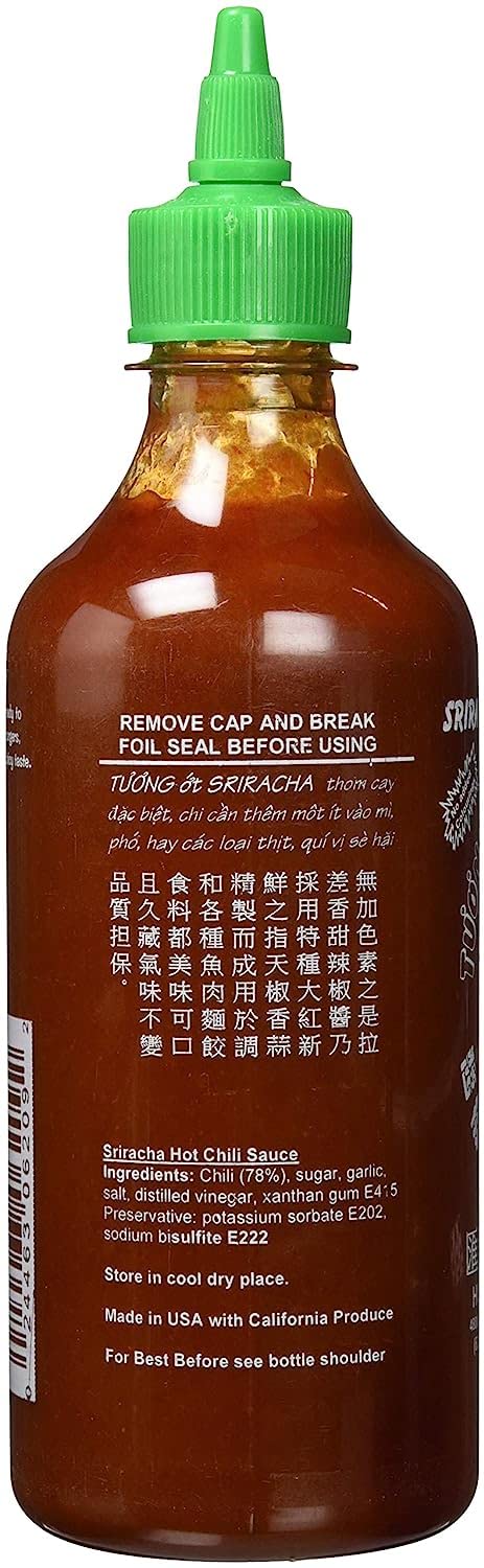 Huy Fong bottle in kitchen next to ramen bowl, demonstrates brand enhancing flavor and ease of use