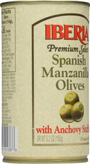 Iberia close-up of Manzanilla olive texture and anchovy filling, highlights firmness