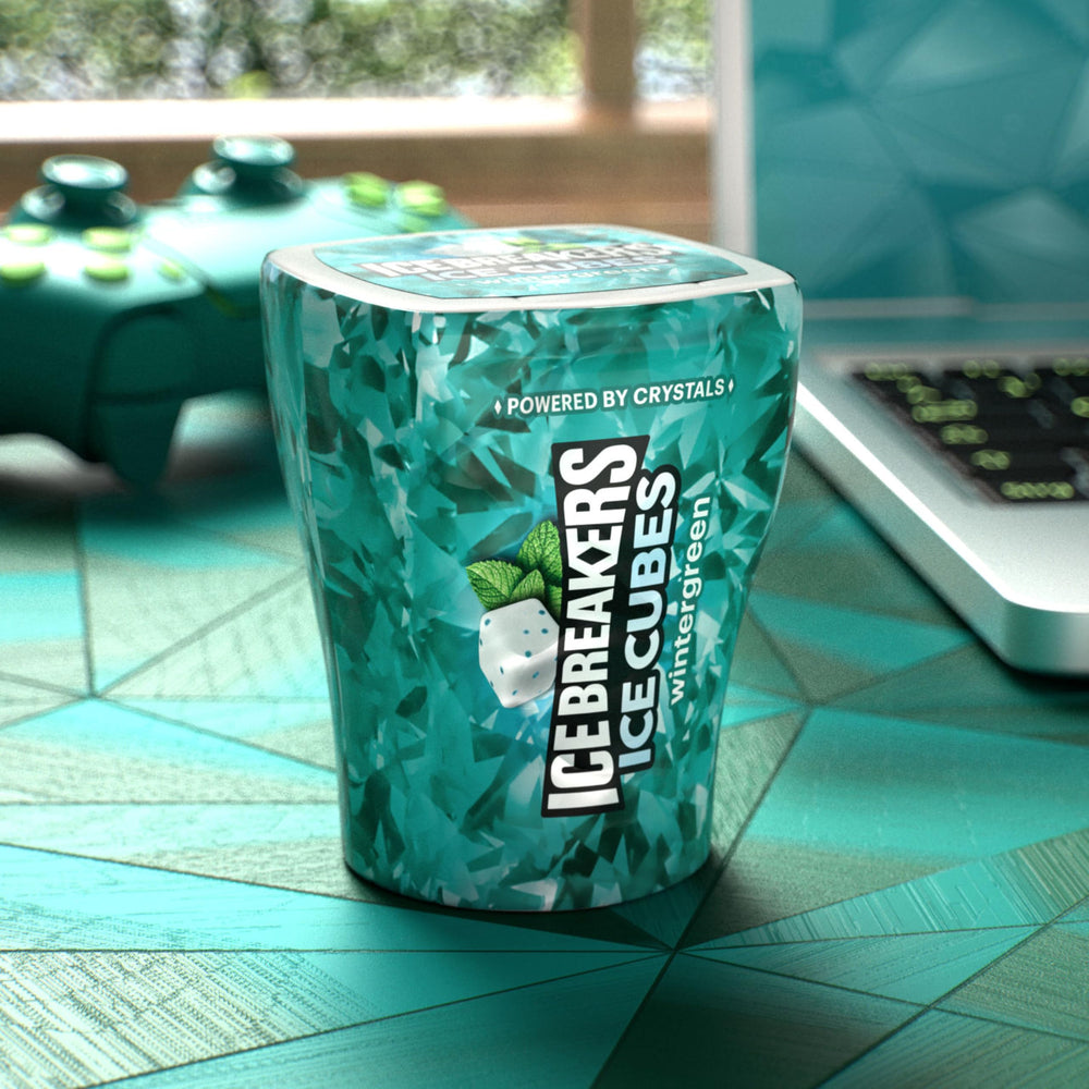 Ice Breakers bottle beside smartphone showing size and portability benefit