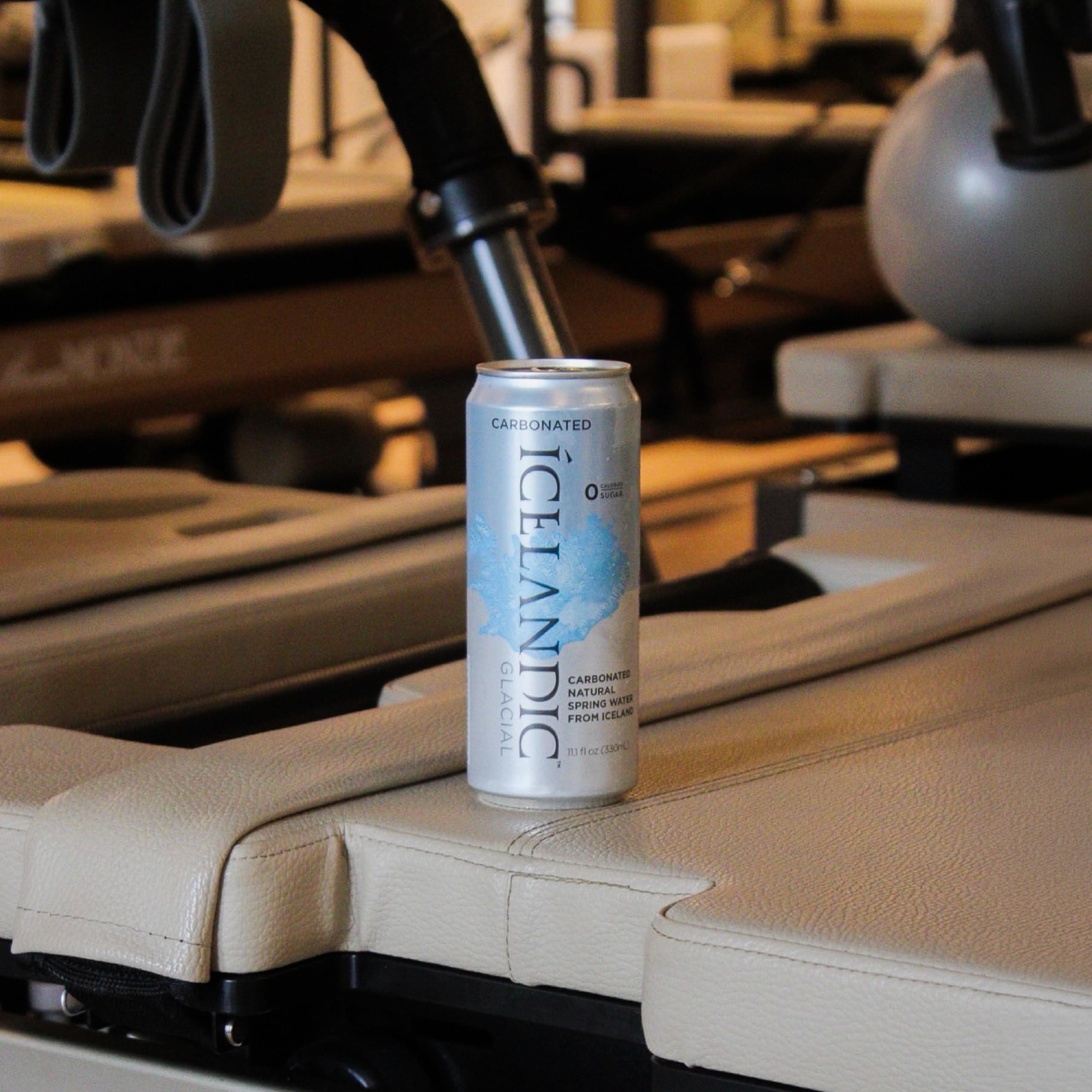 Icelandic Glacial can in hand for scale showing portable 330 ml size and on-the-go benefit