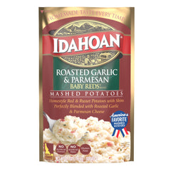 Idahoan mashed Baby Reds plated beside chicken, showing complementary side dish