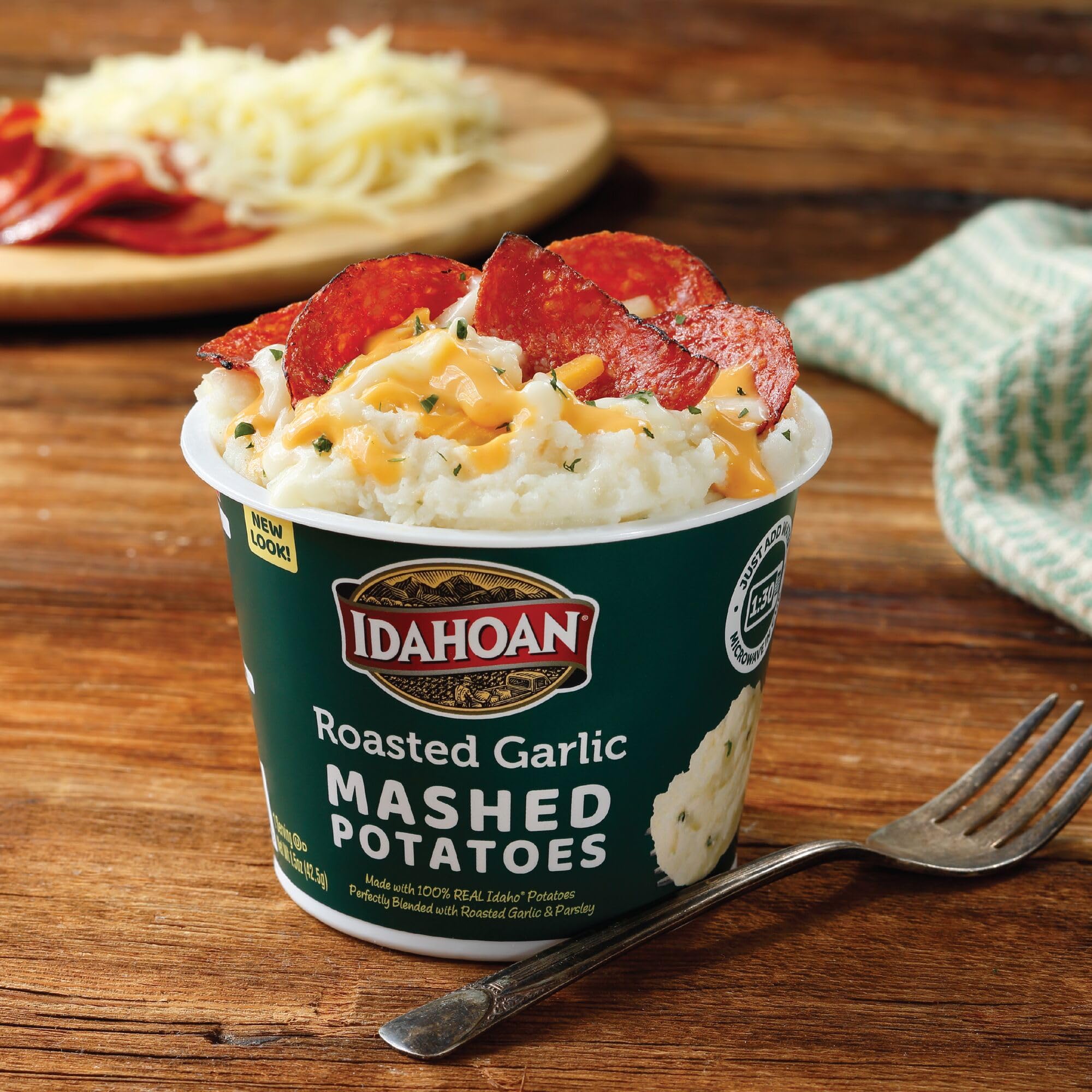 Stacked Idahoan cups on pantry shelf showing space-saving storage convenience