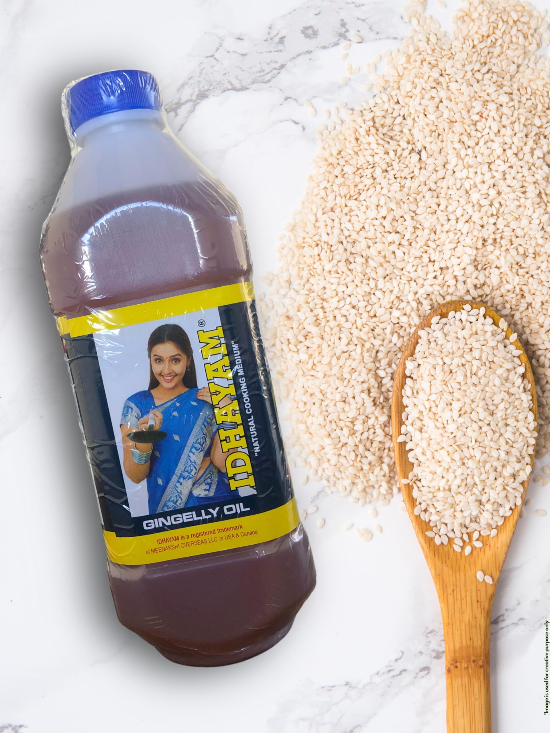 Kitchen scene with Idhayam sesame oil bottle beside dishes showing versatile culinary use