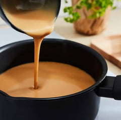 IKEA ALLEMANSRÄTTEN creamy sauce over meatballs showing appetizing finish