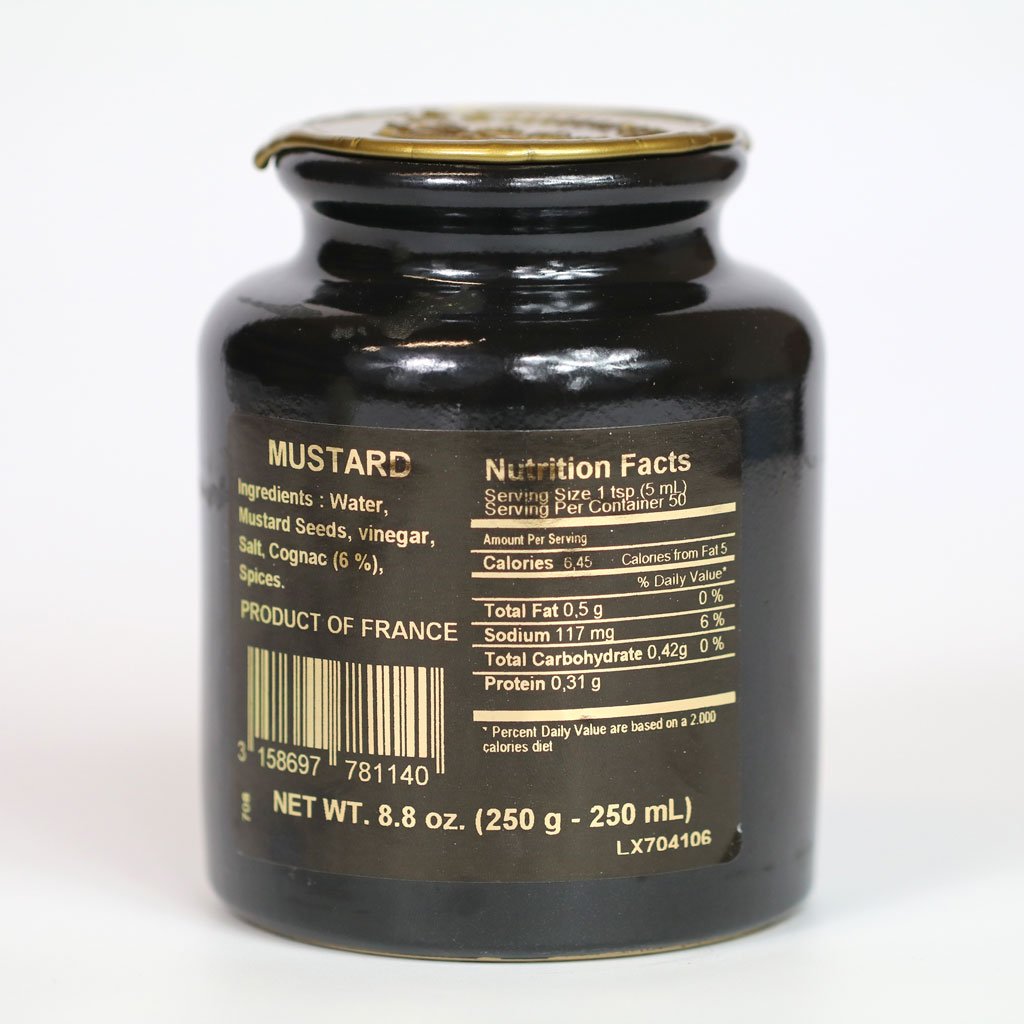 Close-up of IL FUSTINO Pommery mustard seeds and Cognac infusion, textured flavor
