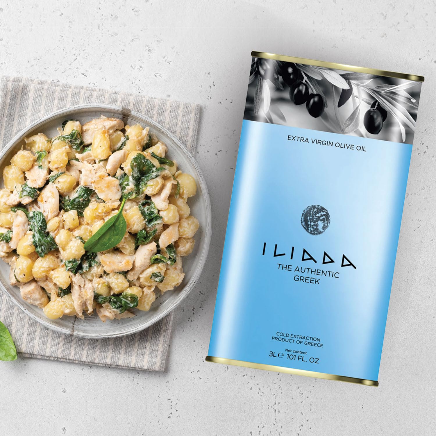 ILIADA used in kitchen over salad illustrating enhanced flavor and finishing