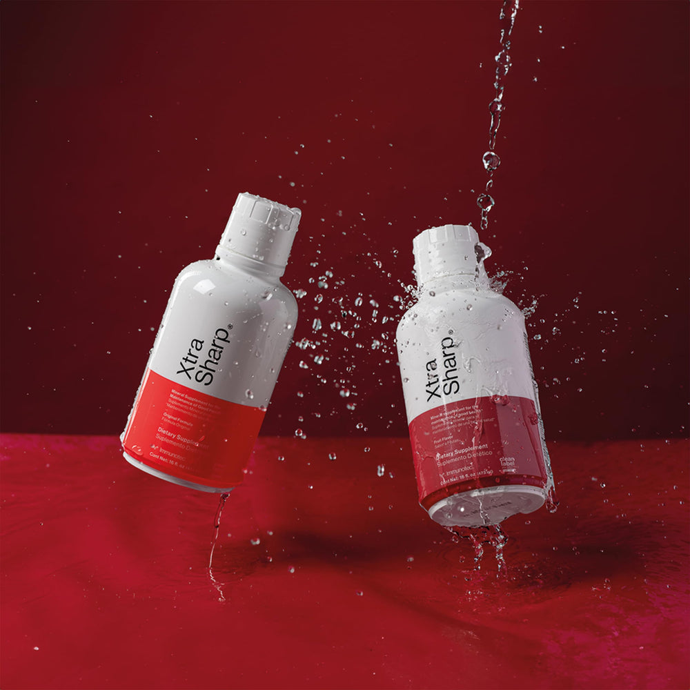 Immunotec Xtra Sharp liquid close-up highlighting rich amber color and smooth texture for quick absorption