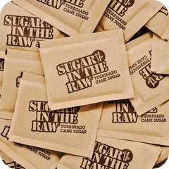 IN THE RAW opened packets with golden crystals, convenient single-serve portioning