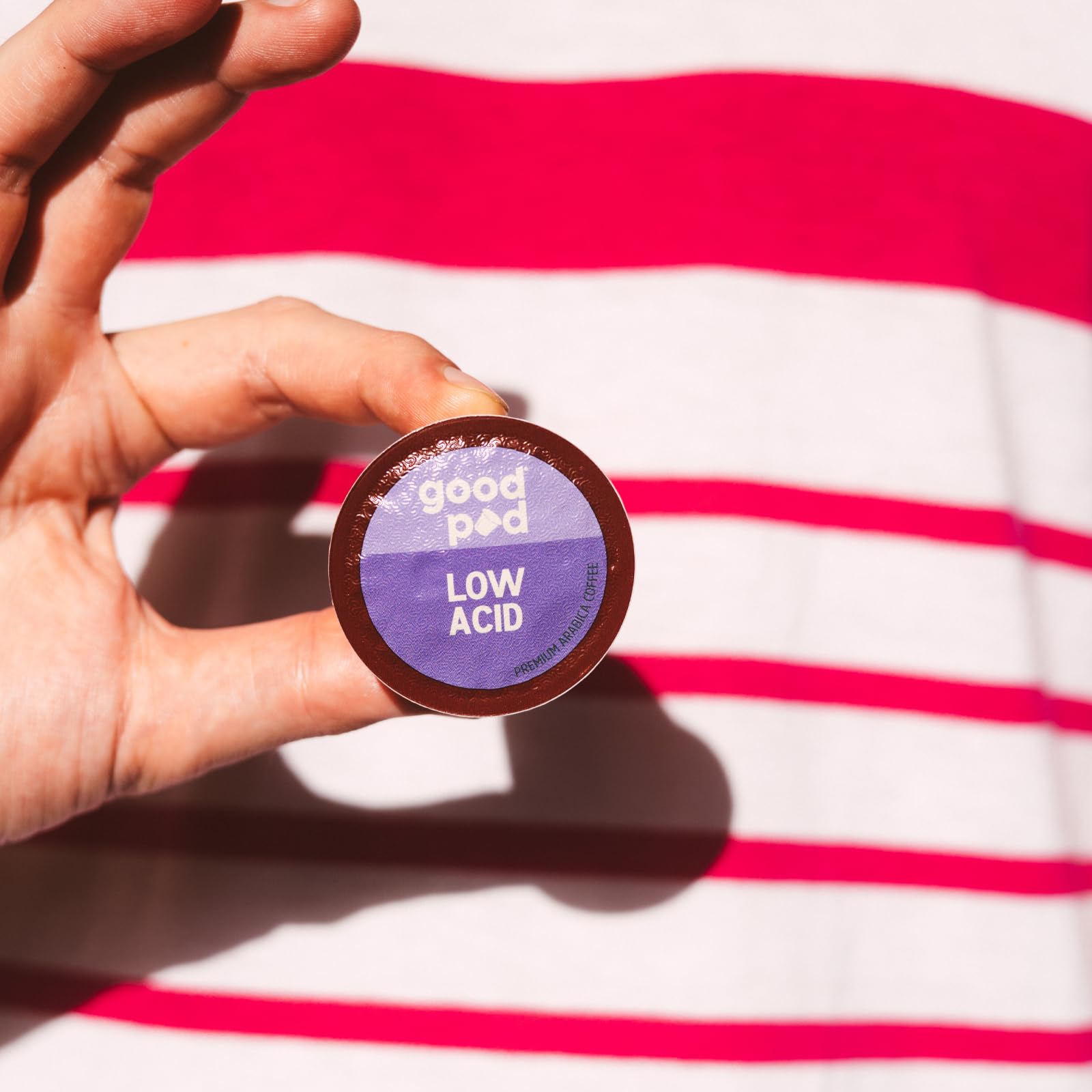 INDEPENDENCE COFFEE CO. goodPOD pod beside a coin showing compact single-serve size