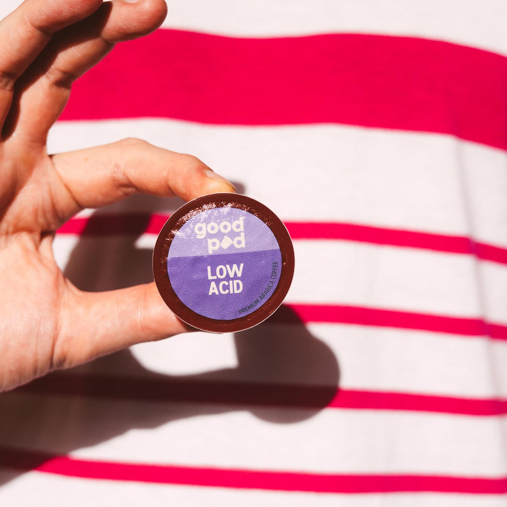 INDEPENDENCE COFFEE CO. goodPOD pod beside a coin showing compact single-serve size