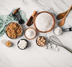 India Tree bag beside a measuring spoon for size comparison and storage convenience