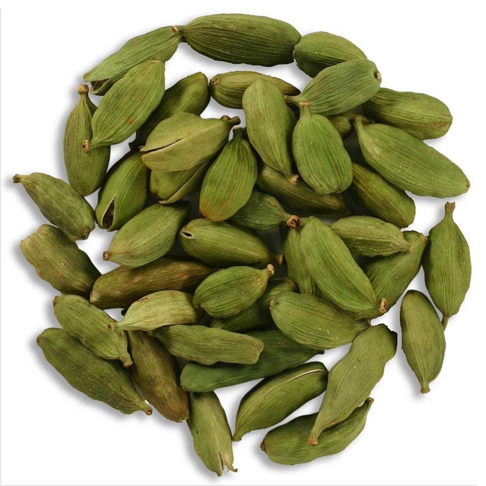 Indian Spice close-up of green cardamom pods texture, showing intact pods for maximum aroma