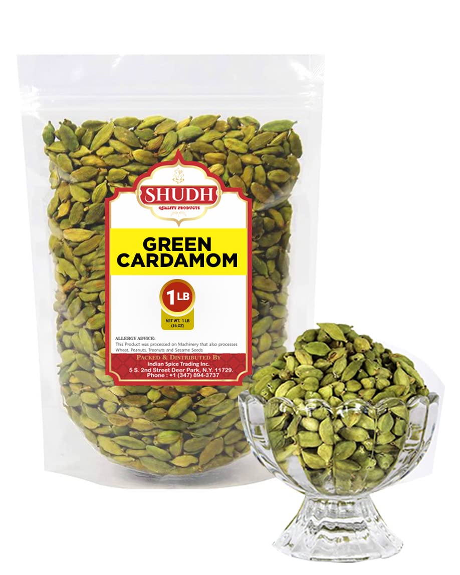 Indian Spice split cardamom pod revealing dark seeds, illustrating potent flavor release