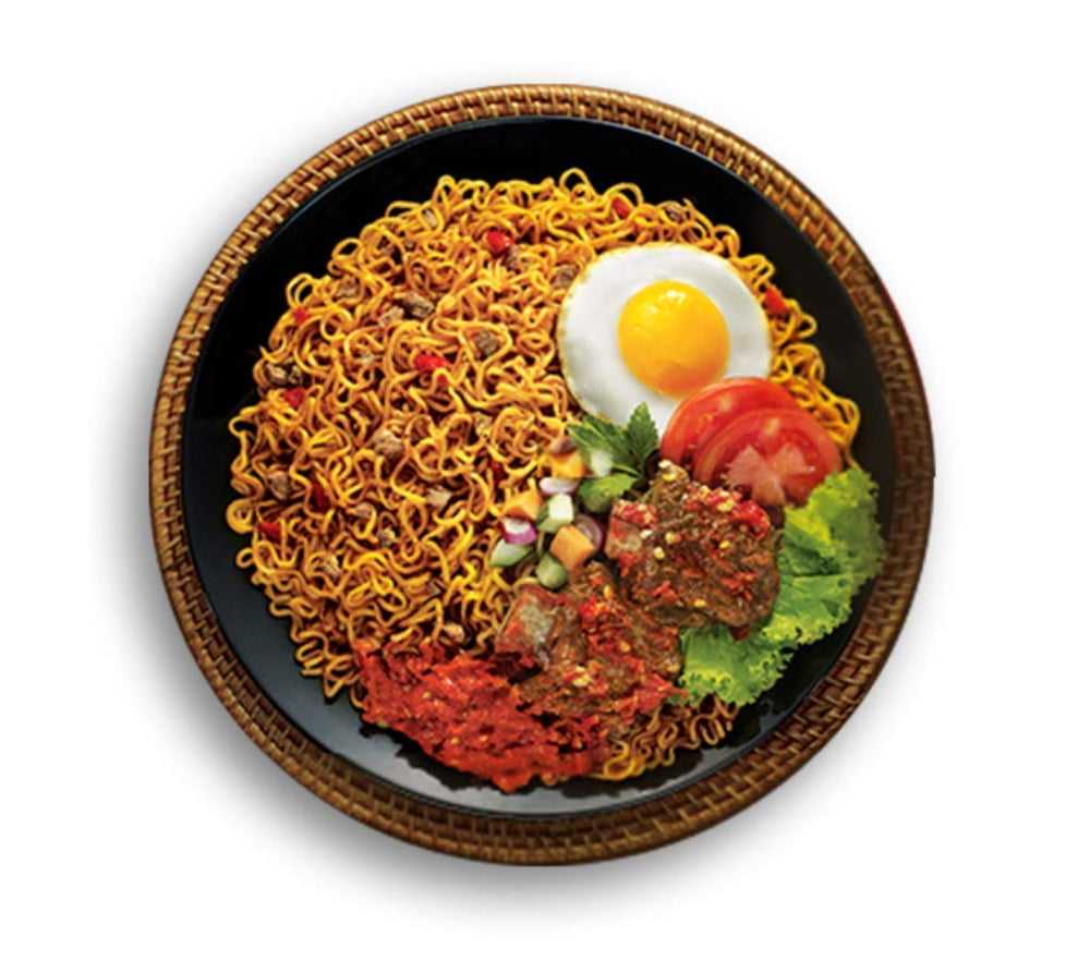 Indomie condiments laid out showing sauces and fried onion for flavoring