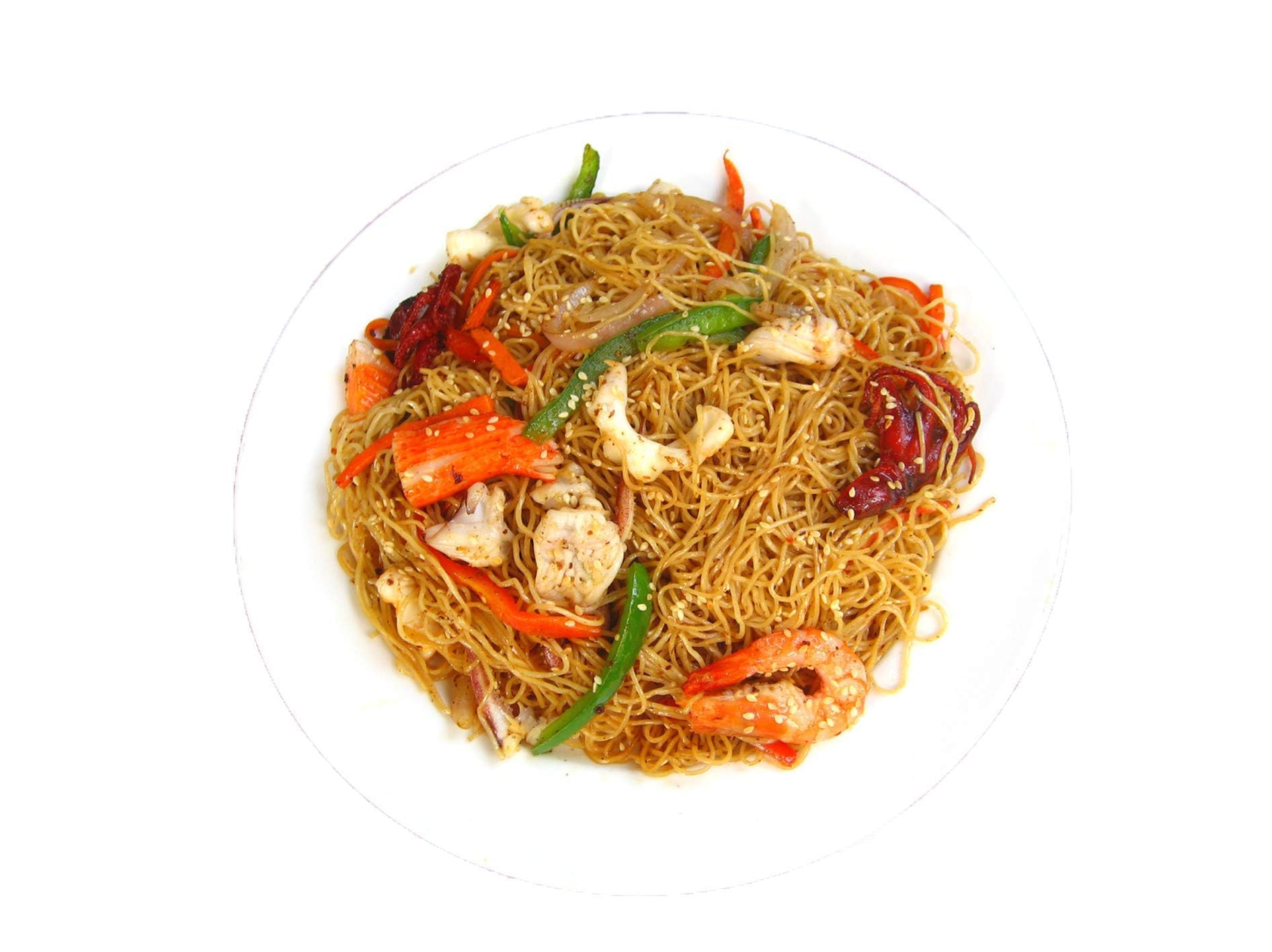 Indomie packet beside a spoon for scale, brand shows single-serve convenience