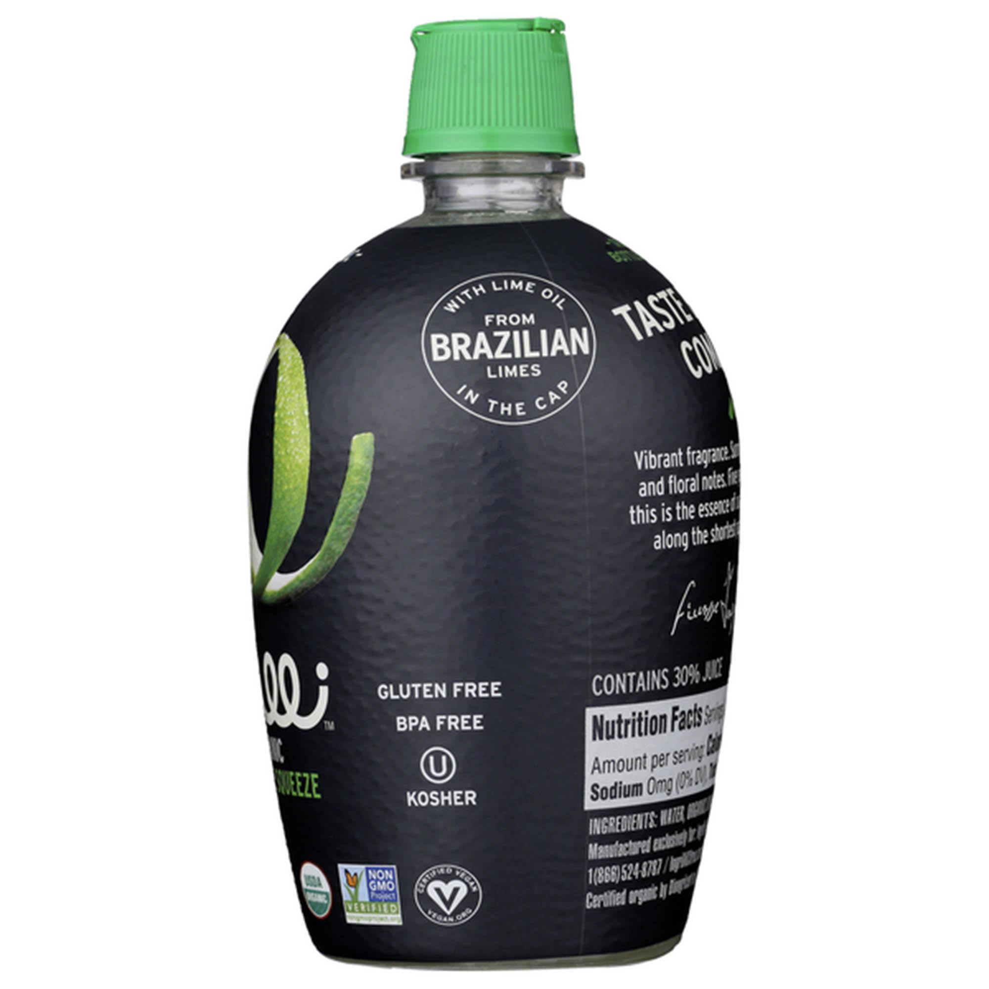 Ingrilli bottle in hand squeezing over salad showing easy use and bright taste benefit