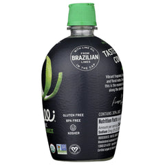 Ingrilli bottle in hand squeezing over salad showing easy use and bright taste benefit