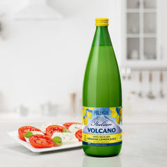 Italian Volcano bottle next to measuring cup showing 1-liter scale