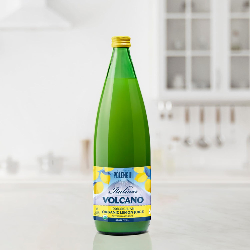 Italian Volcano pouring lemon juice into a glass showing quick beverage prep