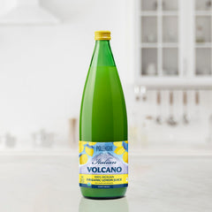 Italian Volcano pouring lemon juice into a glass showing quick beverage prep