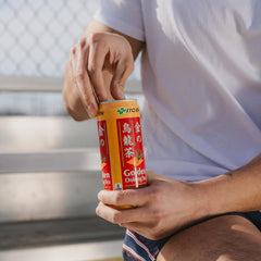ITO EN golden oolong bottle in hand demonstrating portable 10.6 oz serving convenience
