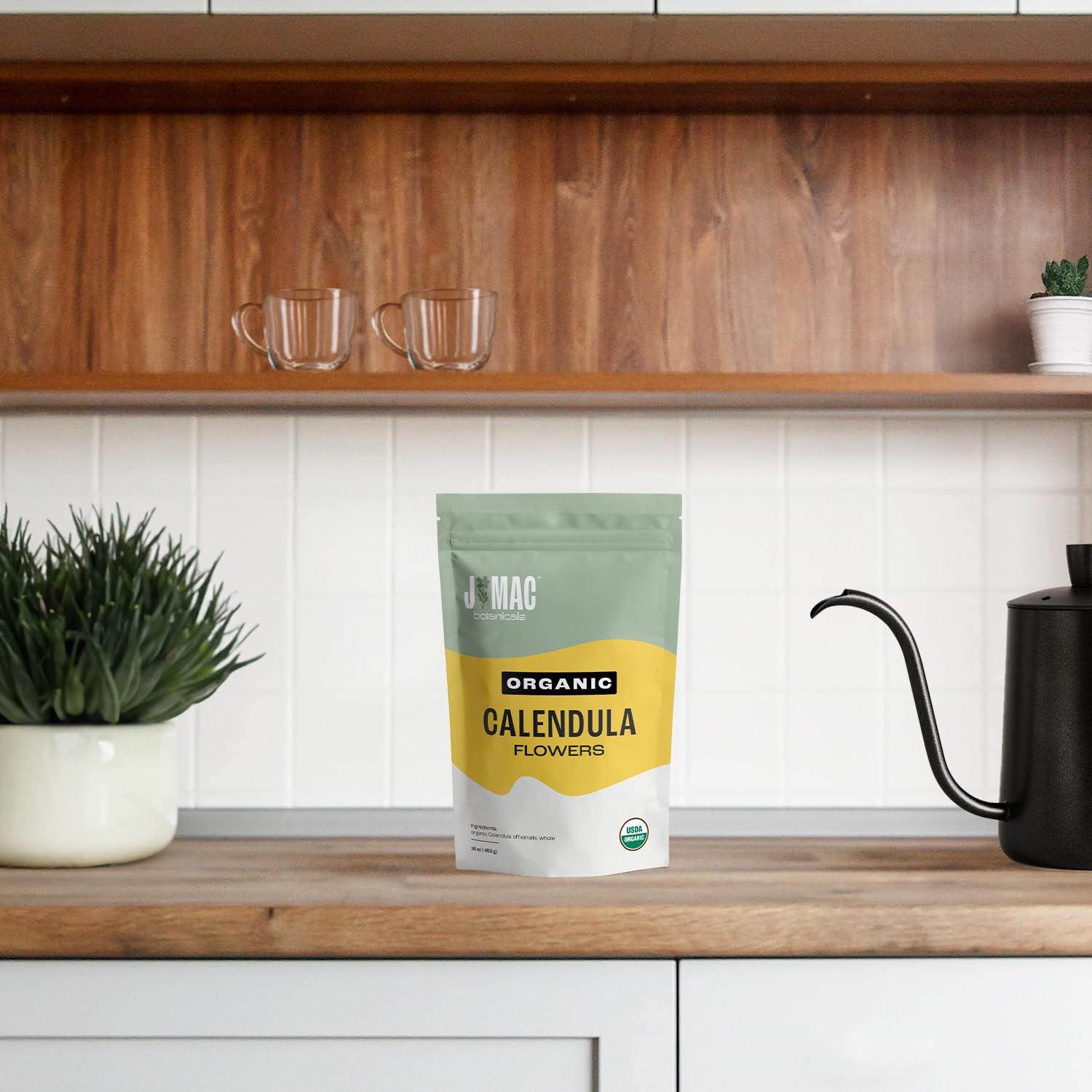 J Mac Botanicals lifestyle kitchen scene with petals, filters and utensils inspiring everyday use