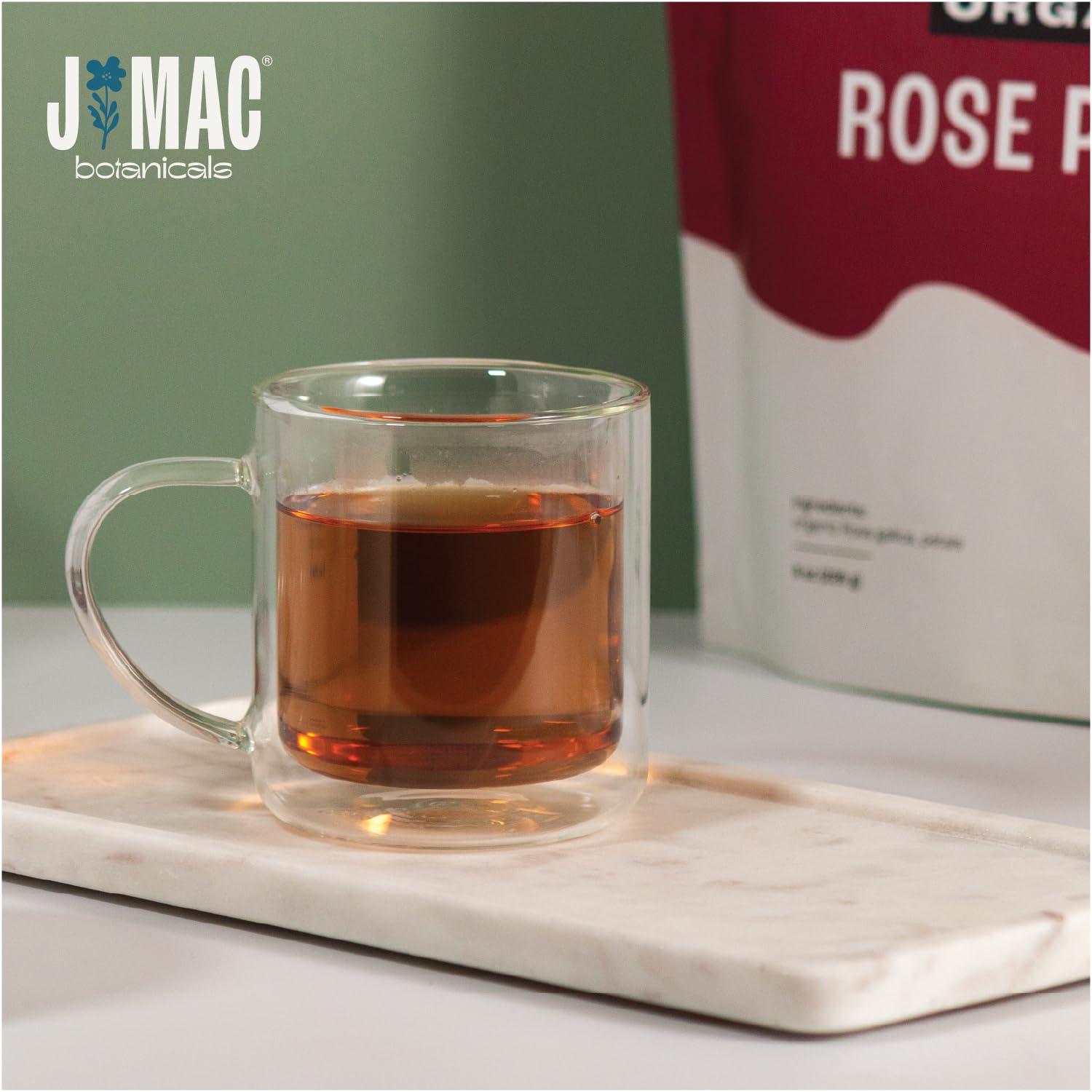 J MAC BOTANICALS petals steeping in cup showing fragrance extraction benefit