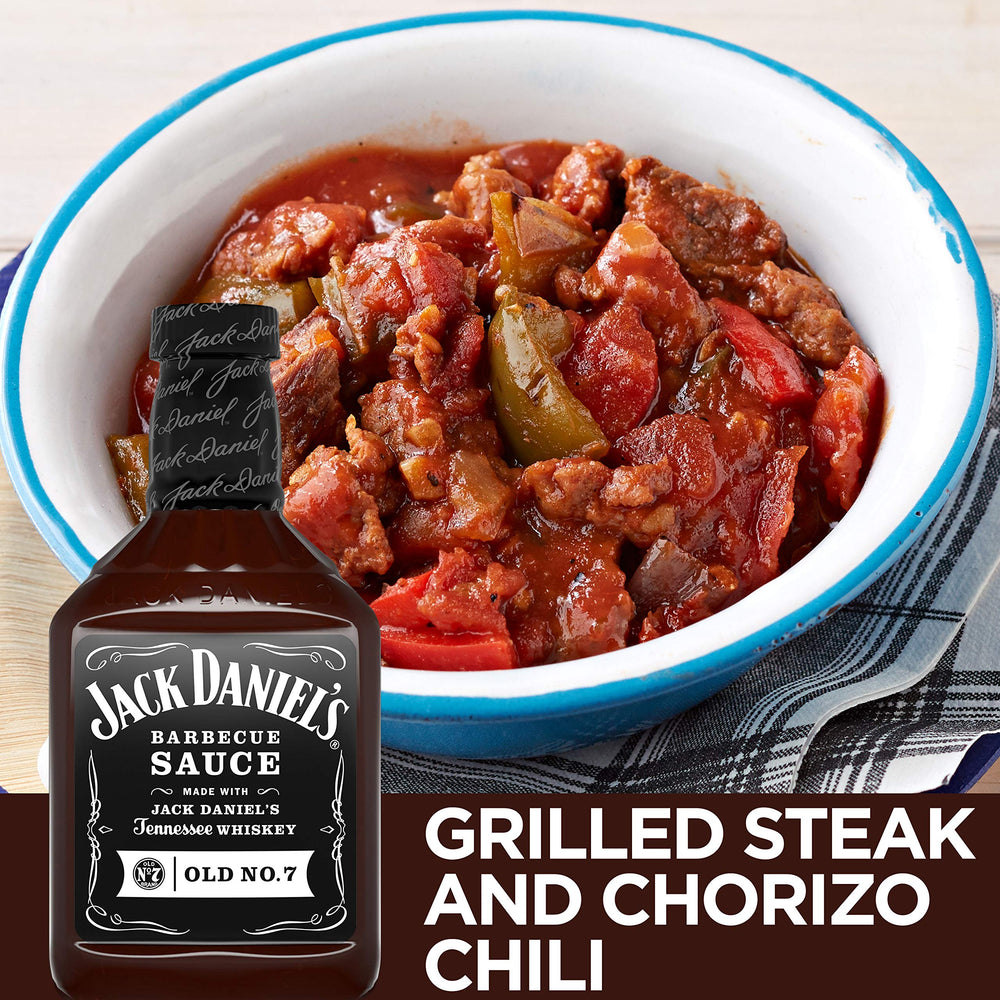 Jack Daniel's pouring sauce onto ribs in use to create sticky caramelized crust