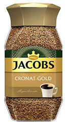 Jacobs Cronat Gold spoonful closeup highlighting fine granules and rich aroma benefit