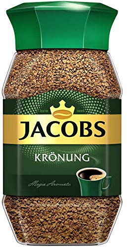 Jacobs Kronung open jar with granules close-up showing texture and fast-dissolving benefit