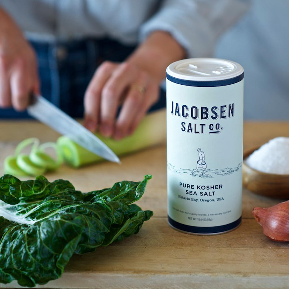 Jacobsen Salt Co. kitchen lifestyle shot showing jar on counter with food