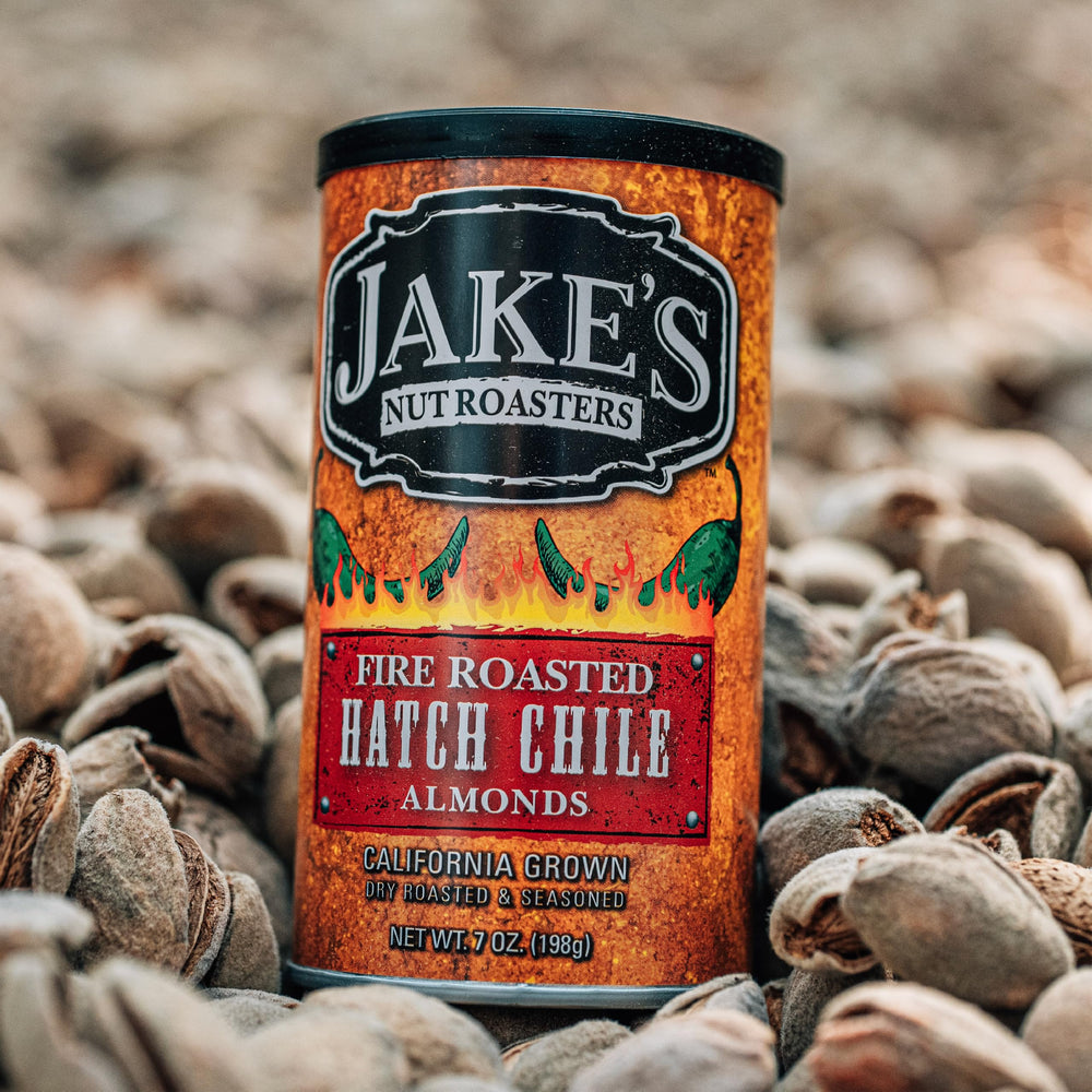 Jake's Nut Roasters hand holding a can to show 7 oz scale and portability