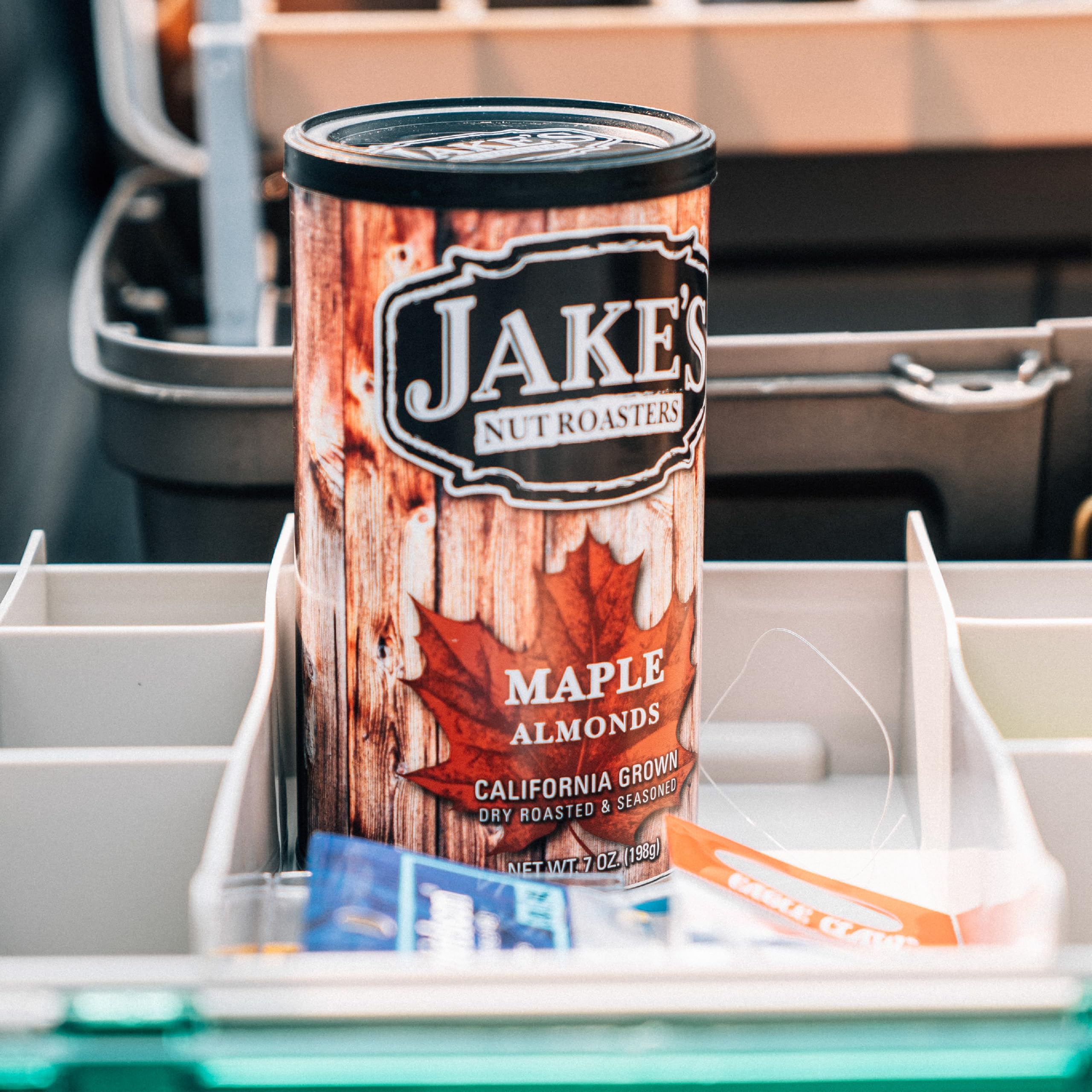 label close-up on Jake's Nut Roasters can highlighting orchard origin and ingredients