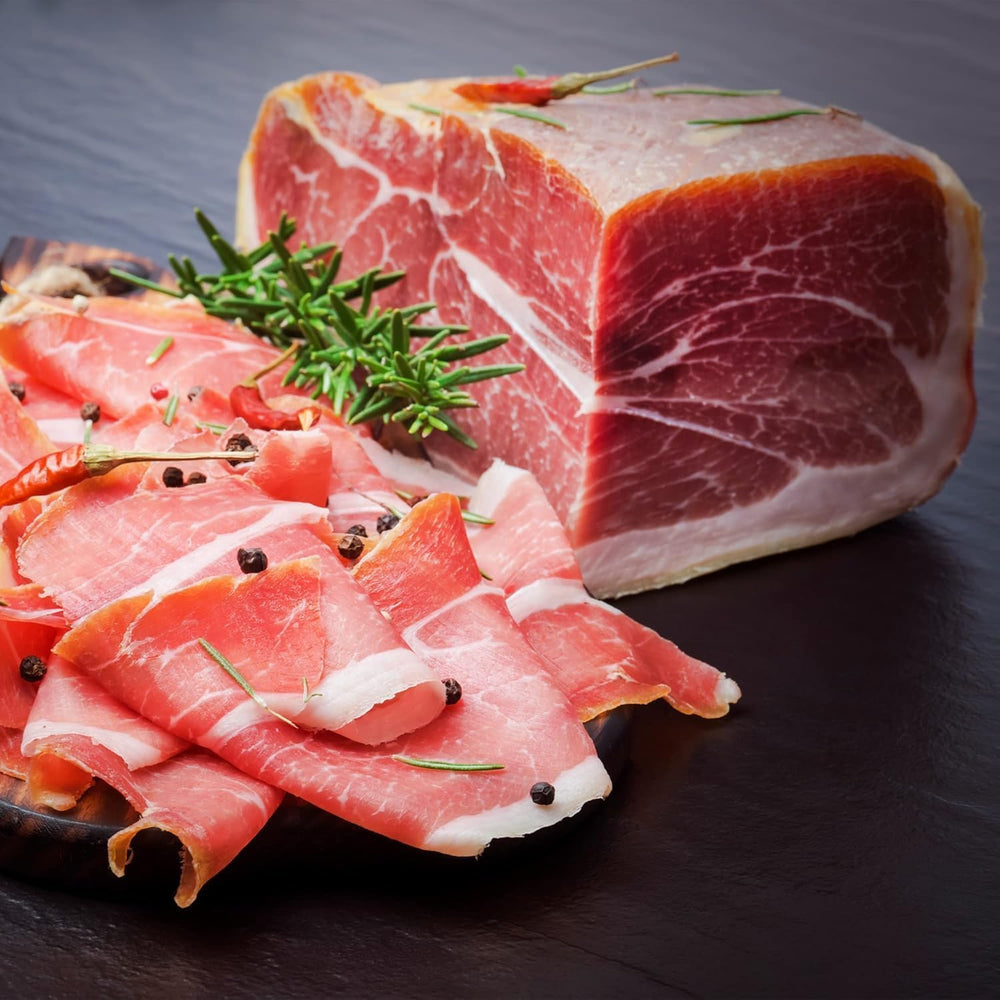 Detail of Jamonprive ham fat and lean color showing glossy fat and purplish-red lean