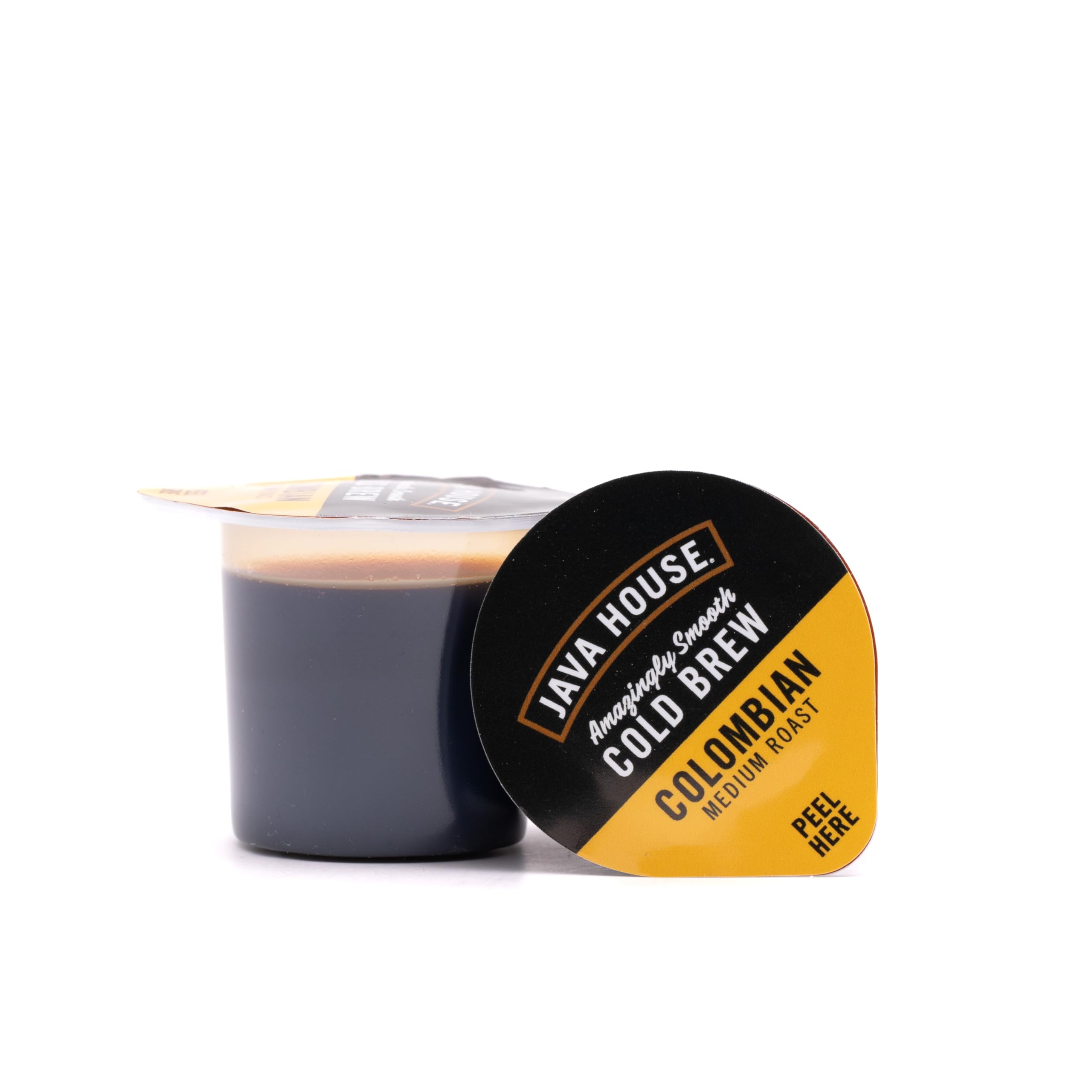 JAVA HOUSE pouring concentrate from a pod into a glass demonstrating quick preparation convenience