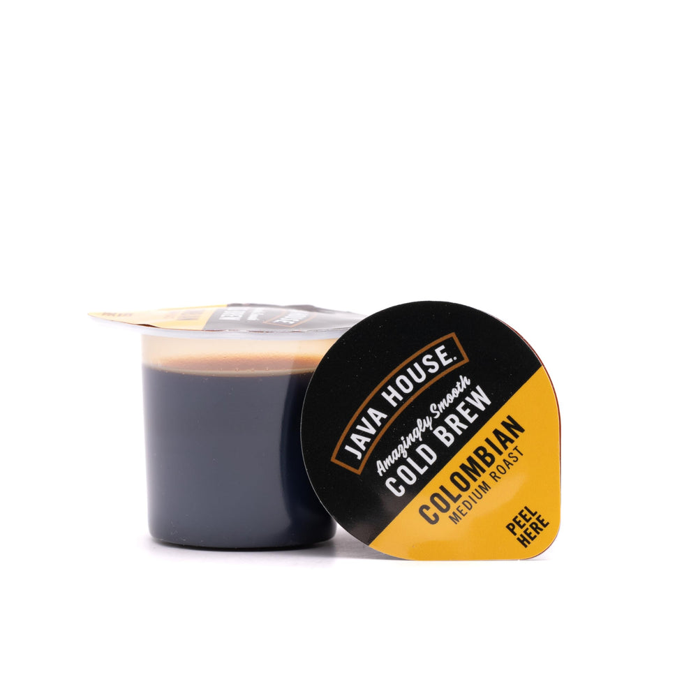JAVA HOUSE pouring concentrate from a pod into a glass demonstrating quick preparation convenience