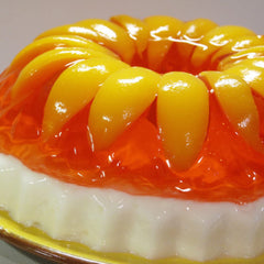 Close-up of Jell-O peach texture highlighting clear wobbly gel and appealing look