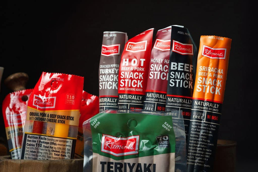 Jerky.com sticks in backpack illustrating portable high-protein snack convenience