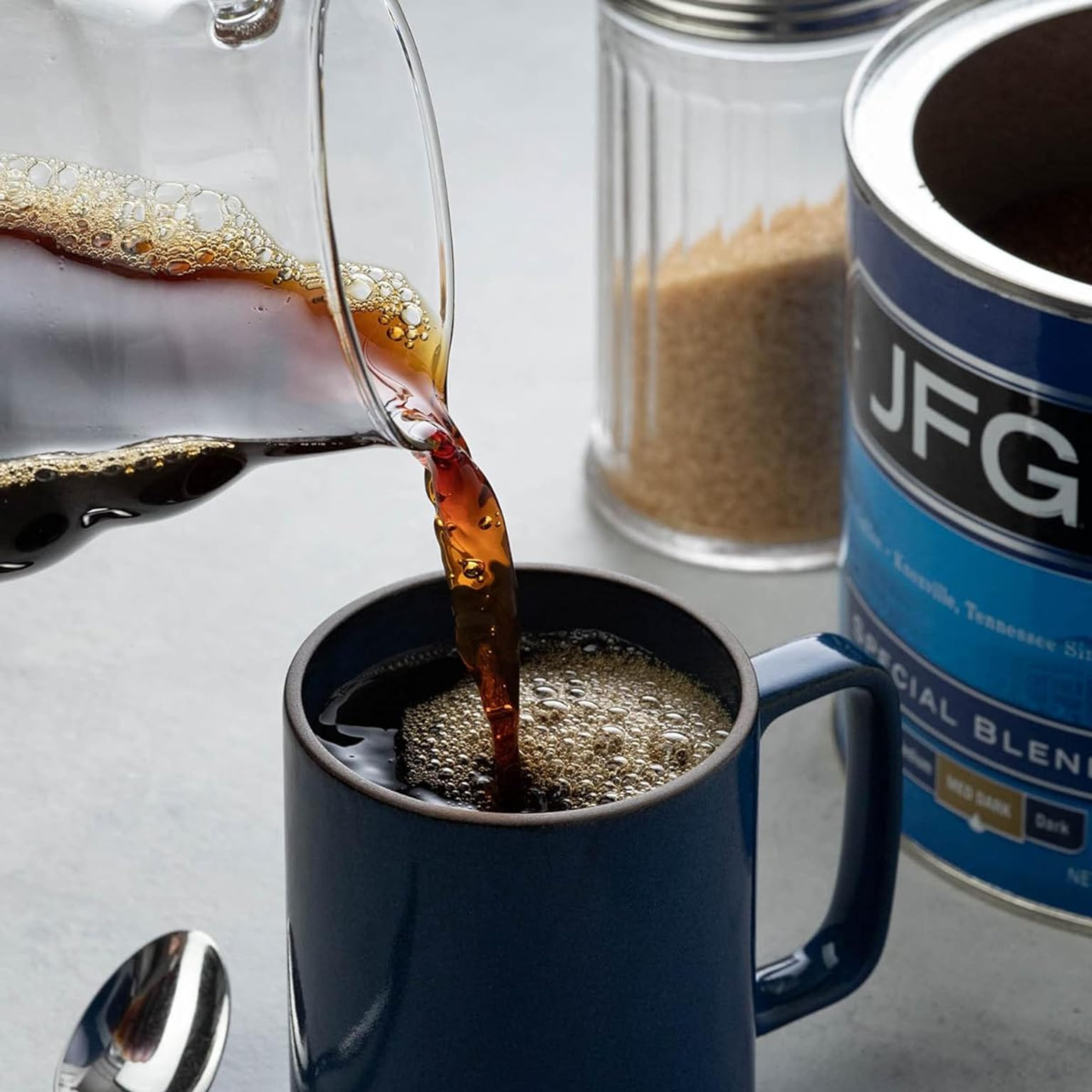 JFG filter pouch on a breakfast table conveying quick, reliable morning coffee