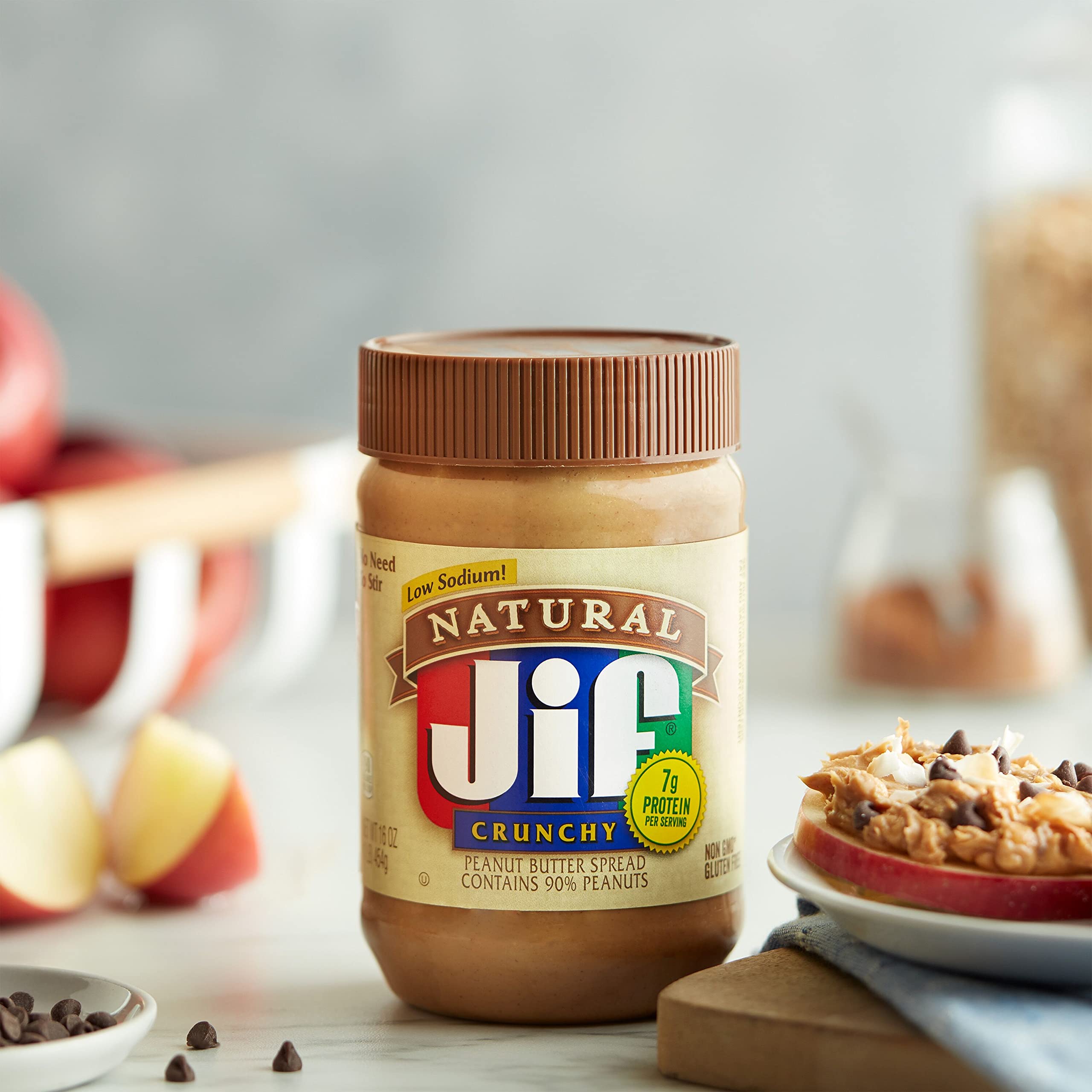 Spoon spreading Jif on bread to show ease of use and taste